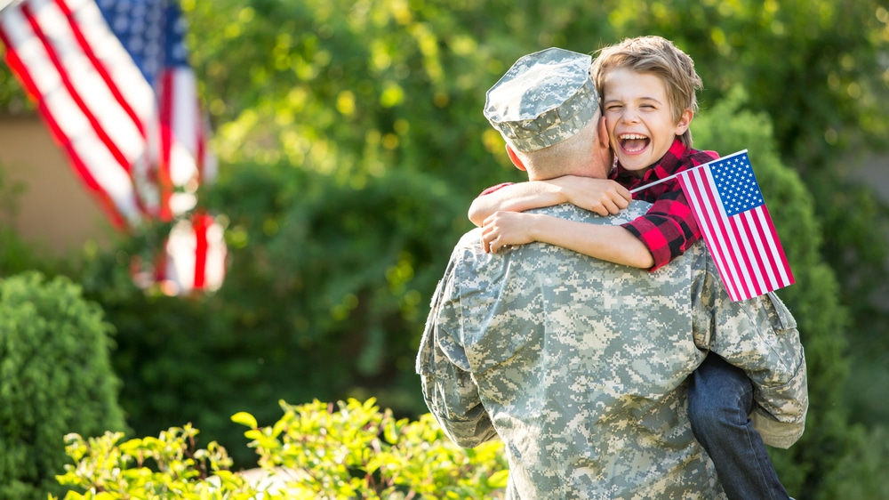 Happy,Reunion,Of,Soldier,With,Family,,Son,Hug,Father