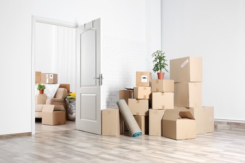 Moving boxes and belongings in a bright home
